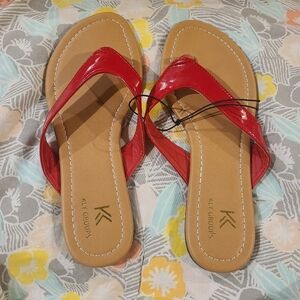 NWOT Red Kly Group Flip Flops
